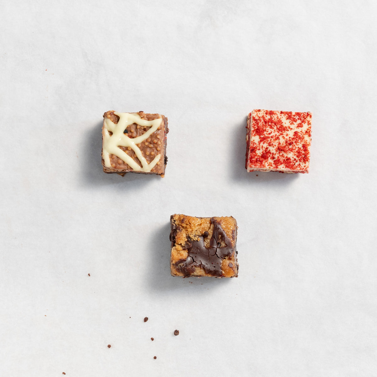  assorted brownies with different toppings and fillings, presented in a visually appealing arrangement.
