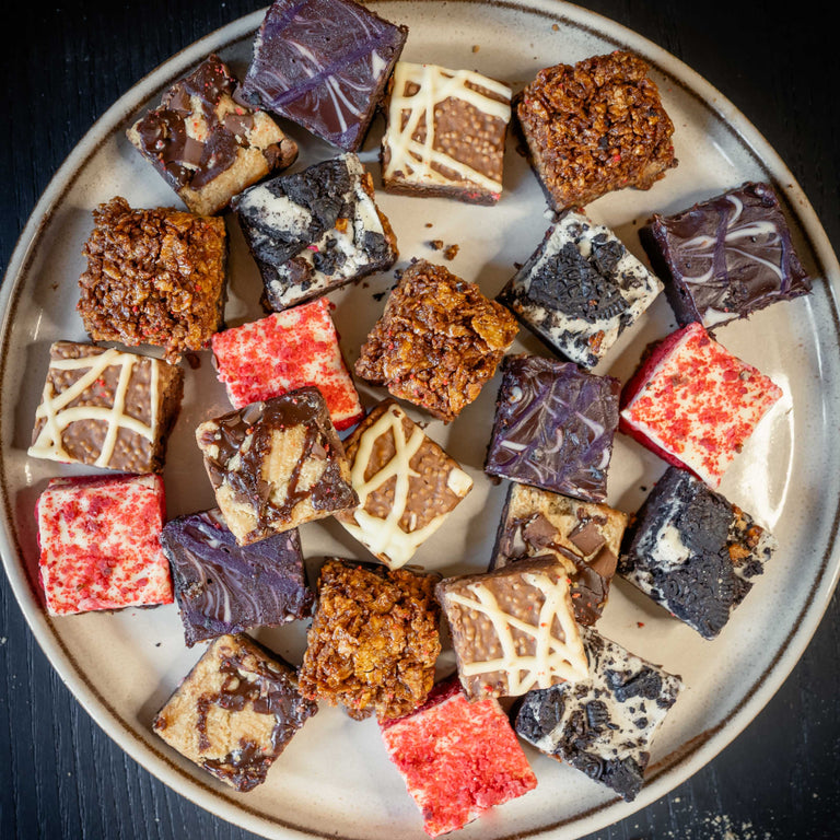 assorted flavours of delicious bad brownie bites on a plate