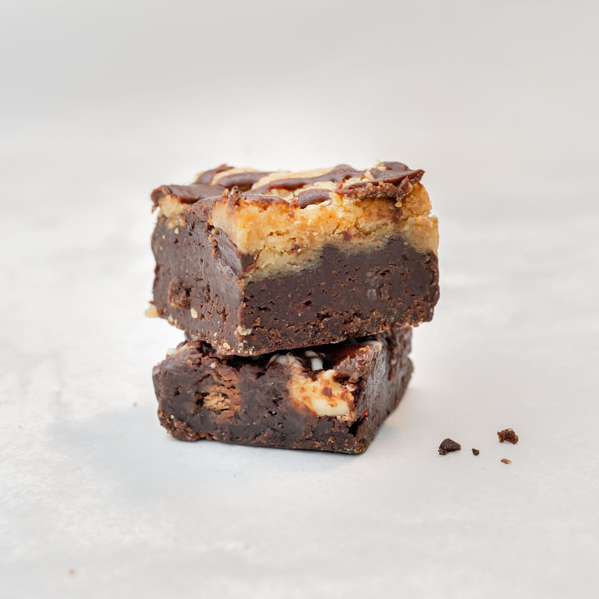 chocolate brownies stacked on top of each other