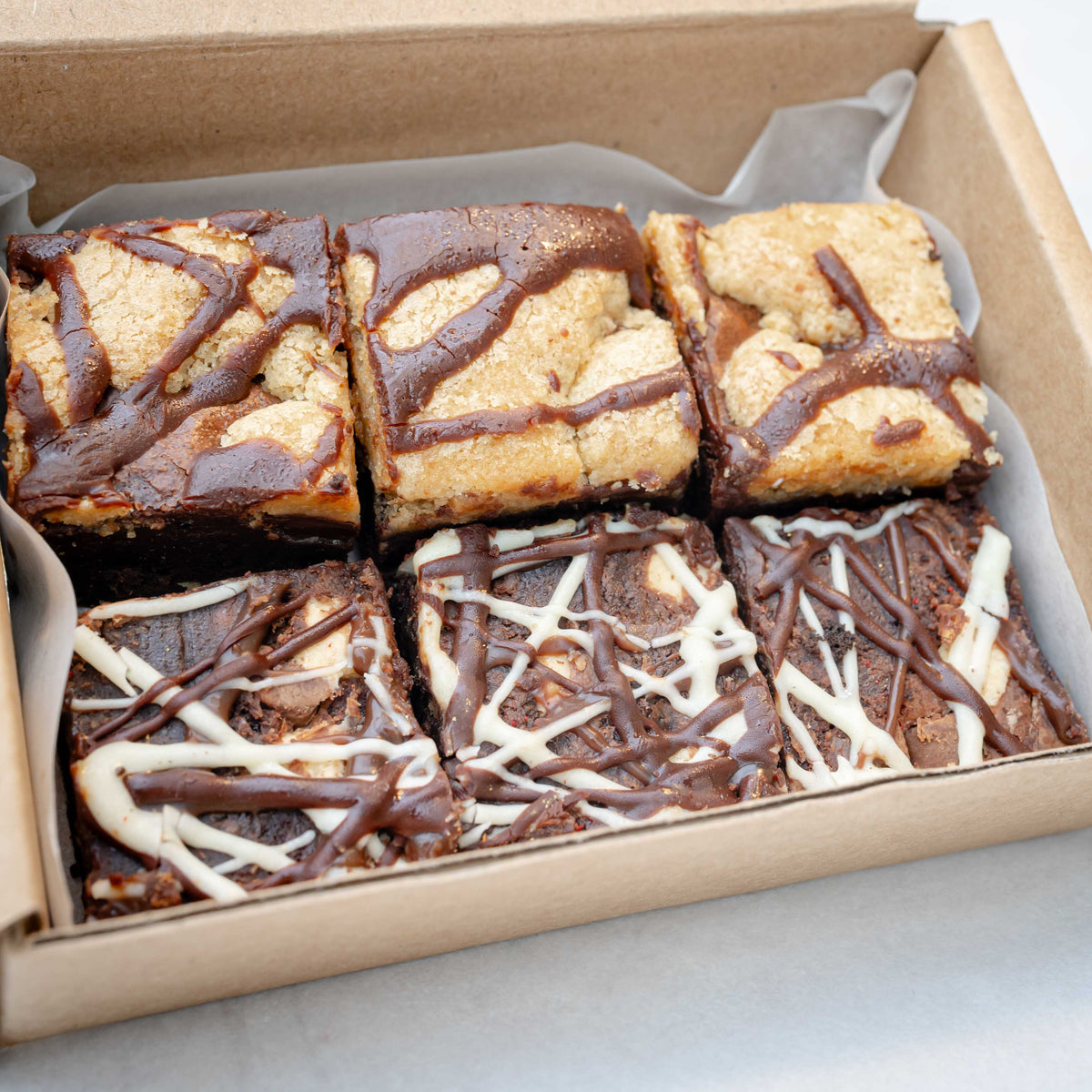 close up of chocolate brownies in a postal box for delivery