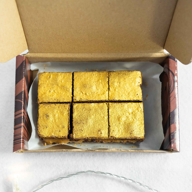 Salted caramel brownies in an open postal box
