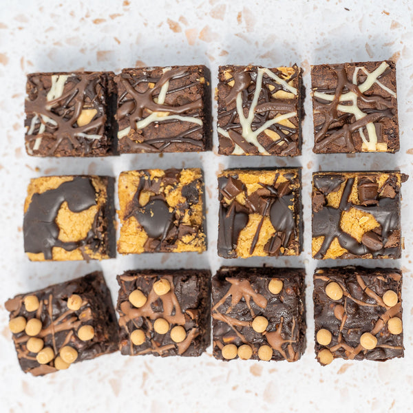 Nine squares of different flavoured chocolate brownies arranged in a 3x3 grid on a light background.