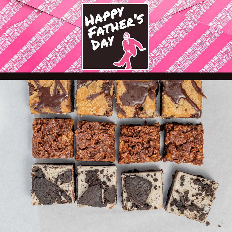Assorted brownies on a gray surface with a 'Happy Father's Day' wrap featuring a pink background and cartoon figure.