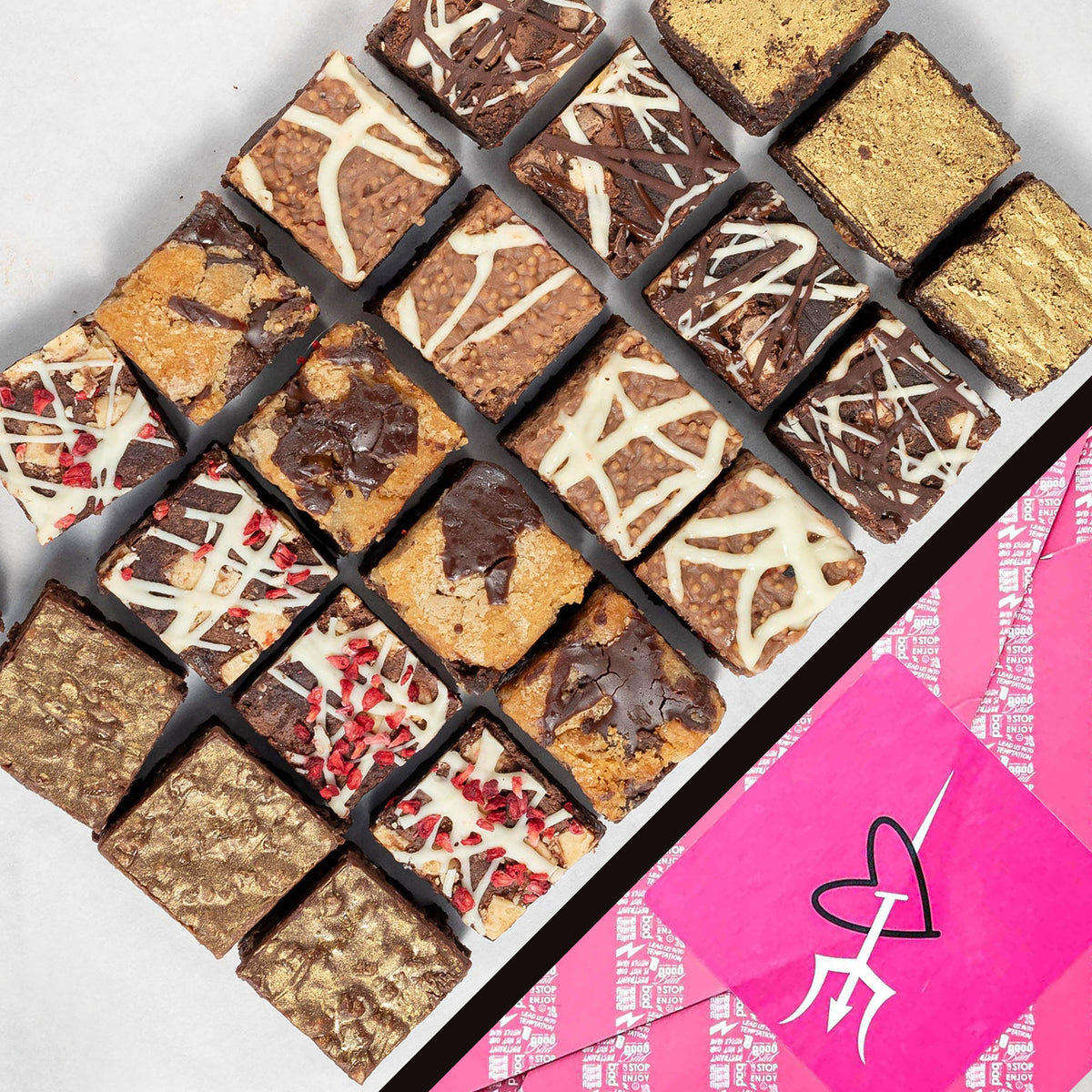 Assorted brownies in a grid pattern with a pink gift box featuring a logo on a white background