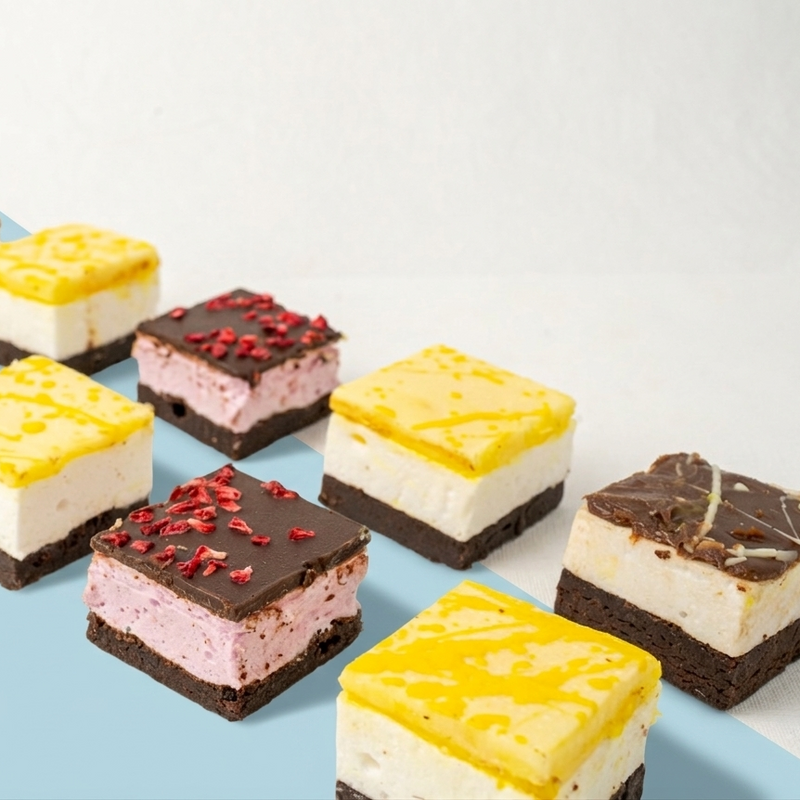 different flavoured marshmallow chocolate brownies on a white and blue surface 