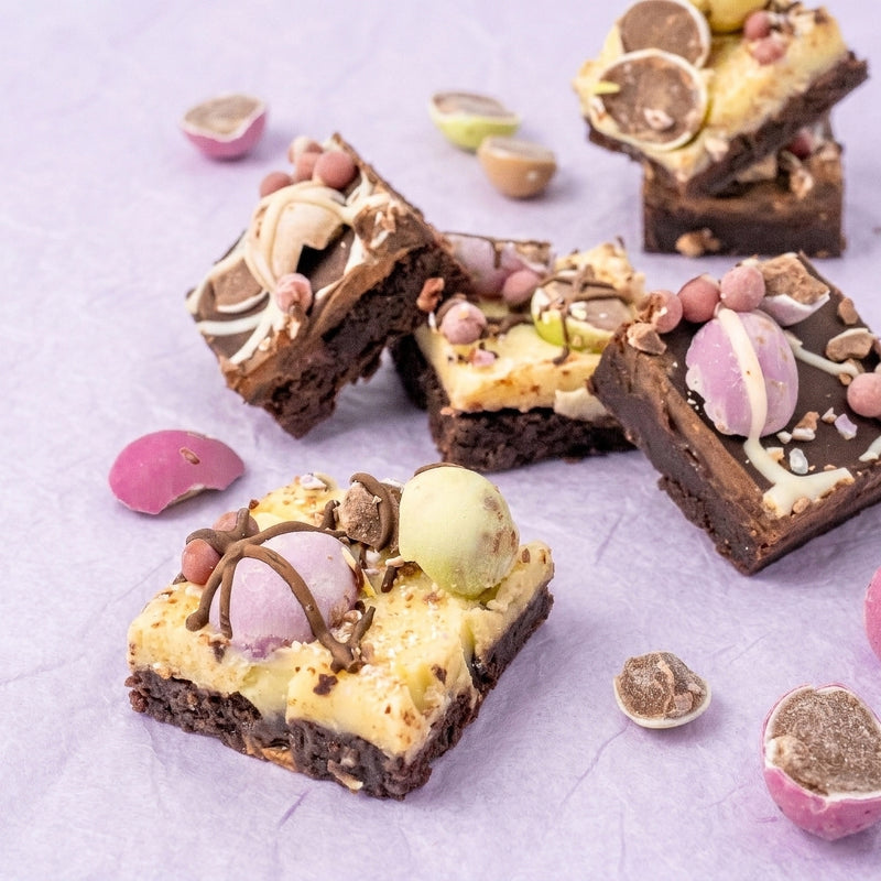 mini egg chocolate brownies on pale purple background